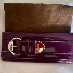 Gucci magenta clutch, patent leather excellent condition worn a few times.